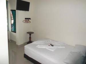 Hotel Monarca Putumayo客房内的一张或多张床位