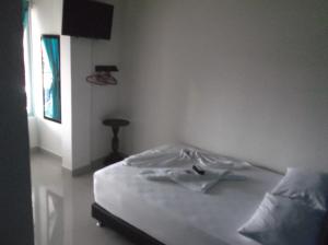 Hotel Monarca Putumayo客房内的一张或多张床位
