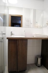 a bathroom with a sink and a mirror at Apartament Nina in Szklarska Poręba