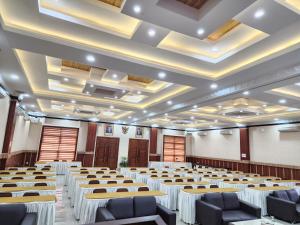 a large room with tables and chairs in it at hotel diana in Banda Aceh