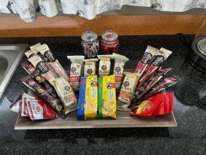 a tray of chips and other snacks on a table at Jacil Riverside Accommodation in Hekpoort