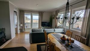 a living room with a table and a couch at Ebbas i Överboda in Överboda