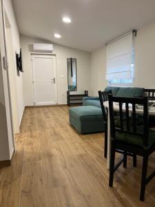 a living room with a couch and a table at Apartman Lea in Sibinj