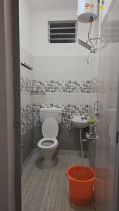 a bathroom with a toilet and a sink at June Villa Feel at Home at yelagiri hills in Yelagiri +16 photos