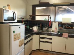 Kuchyň nebo kuchyňský kout v ubytování Guesthouse SHELL