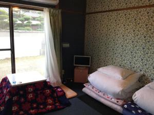 Postel nebo postele na pokoji v ubytování Guesthouse SHELL