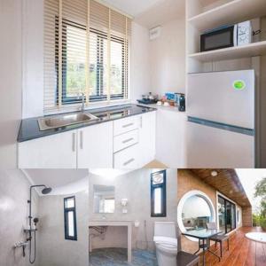a kitchen with white cabinets and a sink at Olympus khaoyai in Ban Nong Makha