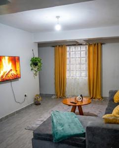 a living room with a couch and a table at Esidai Sidai in Narok