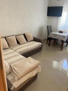 a living room with a couch and a table at Moko in Senj