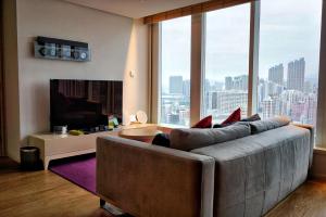 Uma televisão e/ou sistema de entretenimento em Hotel Madera Hong Kong