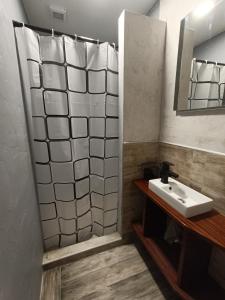 a bathroom with a sink and a mirror at Apartmán U Tří Palem in Břeclav +12 photos