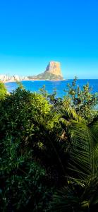 a view of an island in the ocean with bushes at Calpe Cycling in Calpe