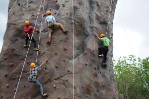 a group of people climbing on a rock wall at Springfield Village Golf & Spa in Cha Am