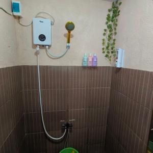 a shower in a bathroom with a shower at Jace Haven Deluxe in Binangonan +13 photos