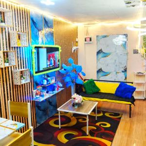 a living room with a couch and a table at Jace Haven Deluxe in Binangonan