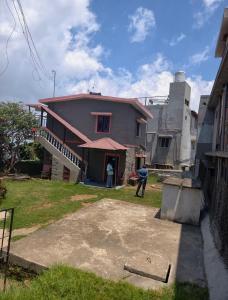 a man standing in front of a house at NILORA stay KODAI in Kodaikānāl