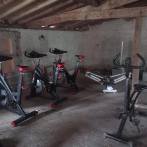 a row of exercise bikes in a room at Le soleil in Chabanais