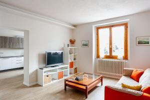a living room with a couch and a tv at Signa, Firenze Casa Pilade in Signa