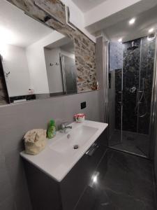 a bathroom with a sink and a shower at Come a casa B&B in Montegrino Valtravaglia +87 photos