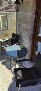 a table and chairs sitting on a patio at Casa Mitola in Congostro +1 photo
