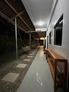 an empty room with benches in a building at Dodong homestay 2 in General Luna +4 photos