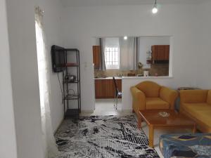 a living room with a couch and a table at Summer House 96 in Salamina