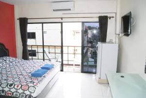 TV a/nebo společenská místnost v ubytování Pineapple Guesthouse
