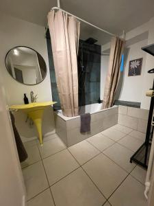 a bathroom with a shower and a sink and a mirror at vitalpha lodge - house in Glarus +33 photos