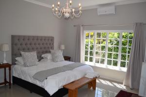 Ένα ή περισσότερα κρεβάτια σε δωμάτιο στο The Garden Shed Guest House