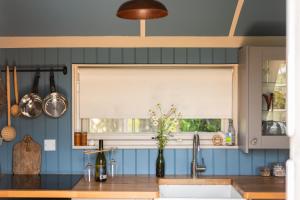 a kitchen with a window and a sink and a sink at Peace in Piece in Redruth