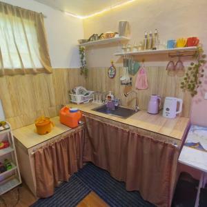 a kitchen with a sink and a counter top at Jace Haven Deluxe in Binangonan