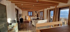 a living room with a view of a mountain at Chalet Wildi Horu OG in Niedergesteln