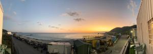 a view of the beach at sunset from a building at Yawen Homestay 雅文民宿 in Lanyu