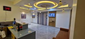 an office with a desk and a computer in a room at Hotel Krishna Palace in Pālanpur +38 photos