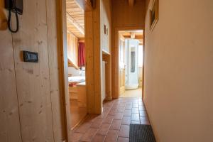 a hallway of a house with a bathroom at Residenza Domino in Selva di Cadore