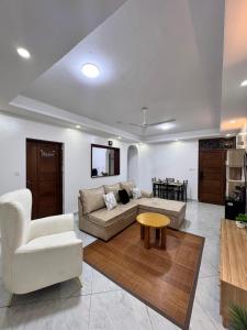 a living room with a couch and a table at Two bedroom, Nyali rd in Mombasa