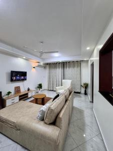 a living room with a couch and a table at Two bedroom, Nyali rd in Mombasa