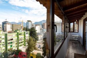a balcony with a view of a city at Central Blloku 2 bedroom Apartment in Tirana