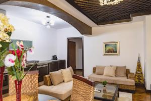 a living room with a couch and a table at Central Blloku 2 bedroom Apartment in Tirana