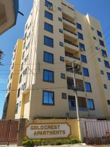 an apartment building with a sign in front of it at Two bedroom, Nyali rd in Mombasa