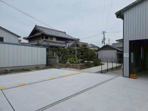 an empty parking lot in front of a building at Tiz円居 in Minamiawaji
