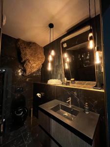a bathroom with a sink and a mirror at Villa Gloria in Tourtour +27 photos