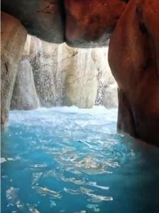 a view of a pool of water in a waterfall at A Casa dos Sonhos in Chaves