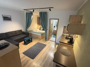 a small living room with a couch and a living room at Relax House in Praid