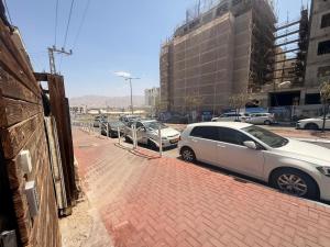 a row of cars parked in a parking lot at ברזיליאנו - Braziliano in Eilat