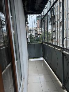 an empty balcony with a view of a city at Big Flat in Tbilisi City