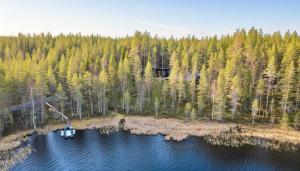 an aerial view of a boat in a lake at Spa Cabin by Hossaville in Hossa