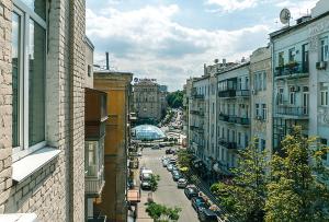 a view of a city street with cars and buildings at HouseHome in Kyiv