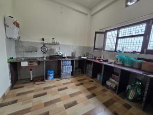 a large room with a sink and a counter top at prabh aasra in Ayodhya