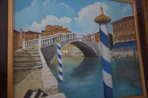 a painting of a bridge over a river at el Capitan de Mar in Chioggia